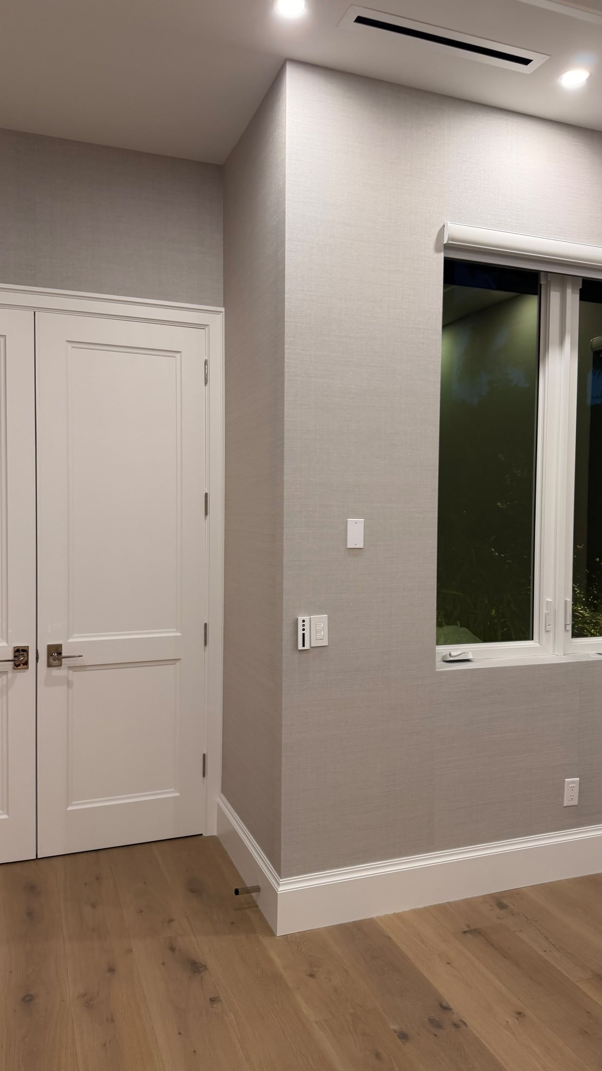 Soft gray grasscloth wallcovering in a Fort Lauderdale home by Salt Wallcovering