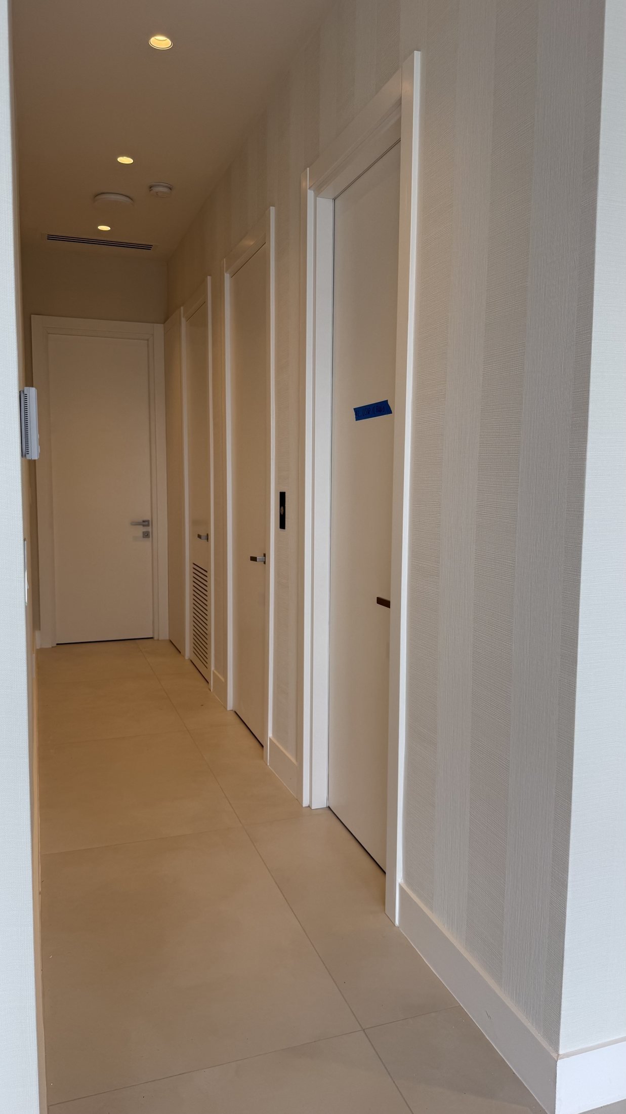 Hallway with wallcovering in a Miami residence by Salt Wallcovering