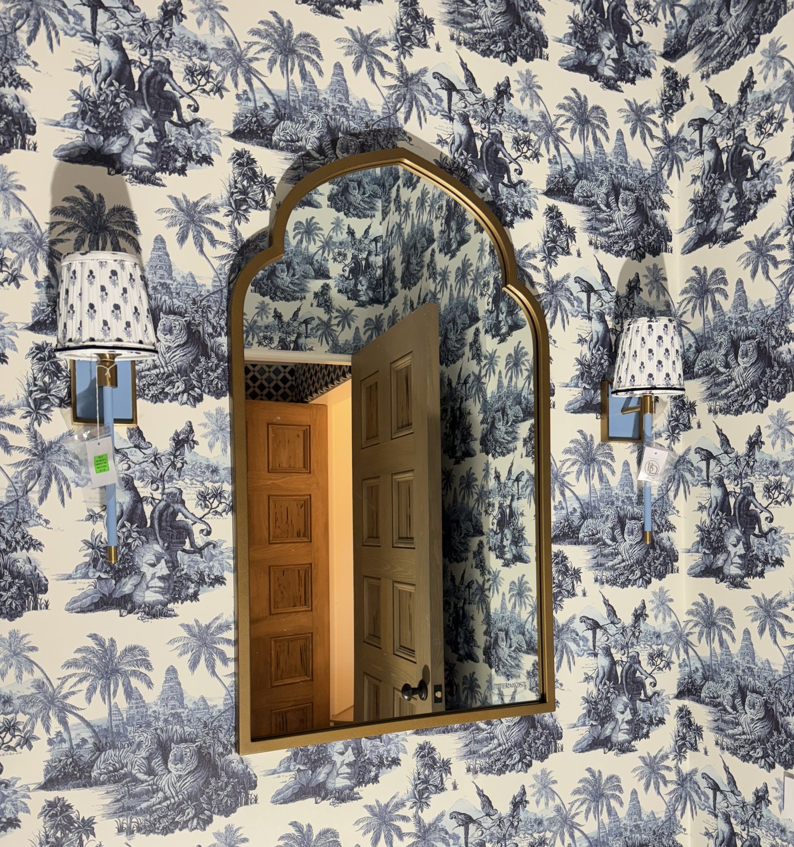 Blue and white hand-drawn wallpaper with a lattice ceiling in a Palm Beach residence by Salt Wallcovering
