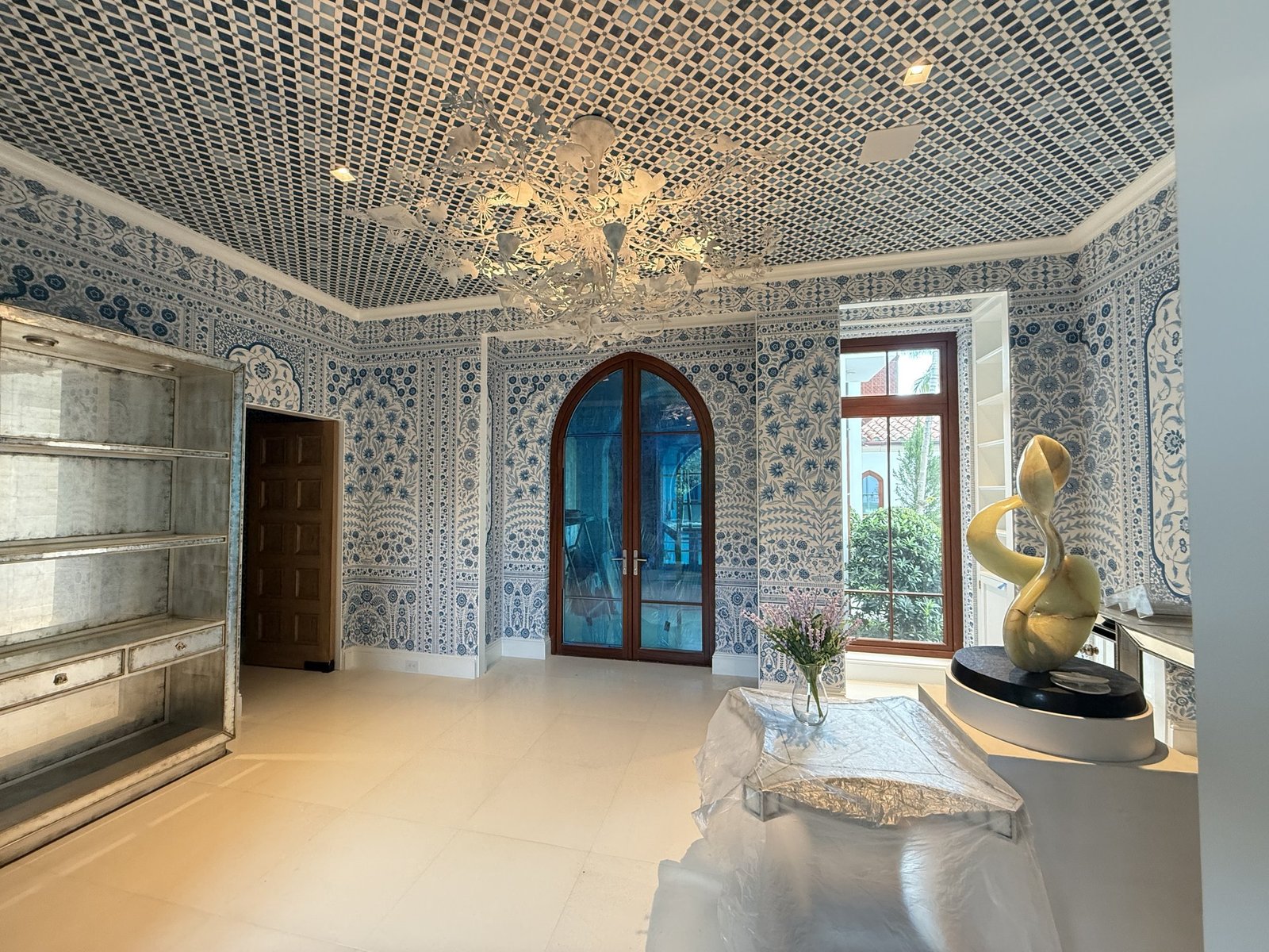 Powder room with blue toile wallpaper in a Palm Beach residence by Salt Wallcovering