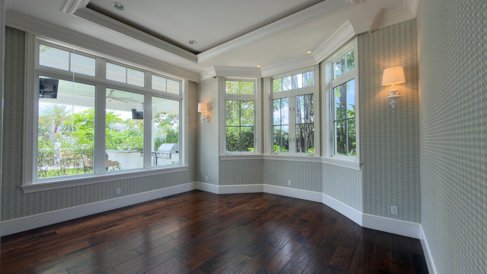 Sunroom with textured geometric wallcovering installed by Salt Wallcovering in a South Florida private residence