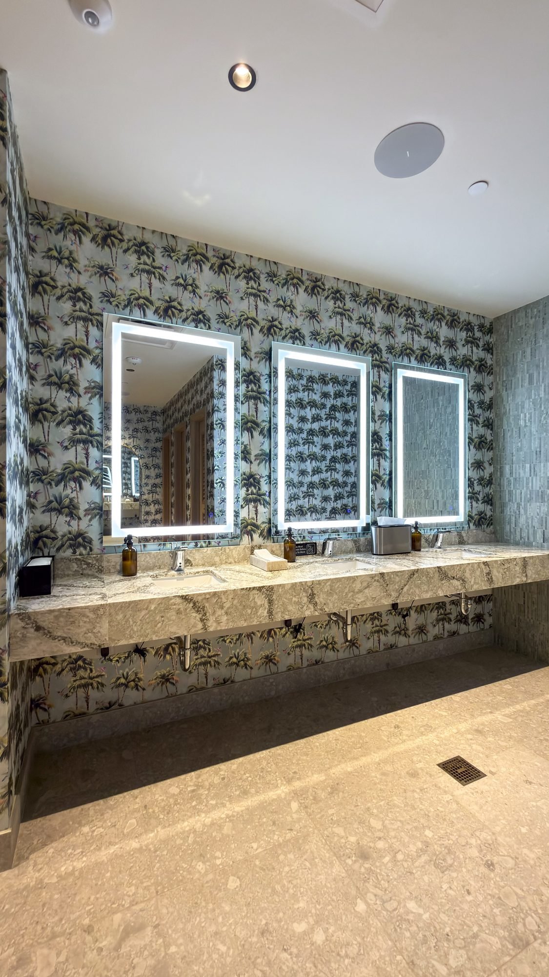 Botanical wallpaper installation in a restaurant restroom in West Palm Beach by Salt Wallcovering