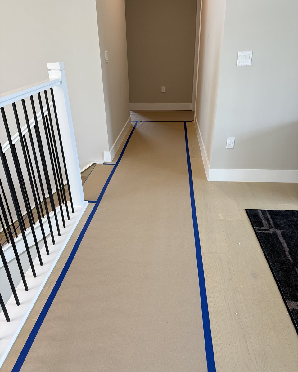 Floors and staircase protected with paper and tape before installation